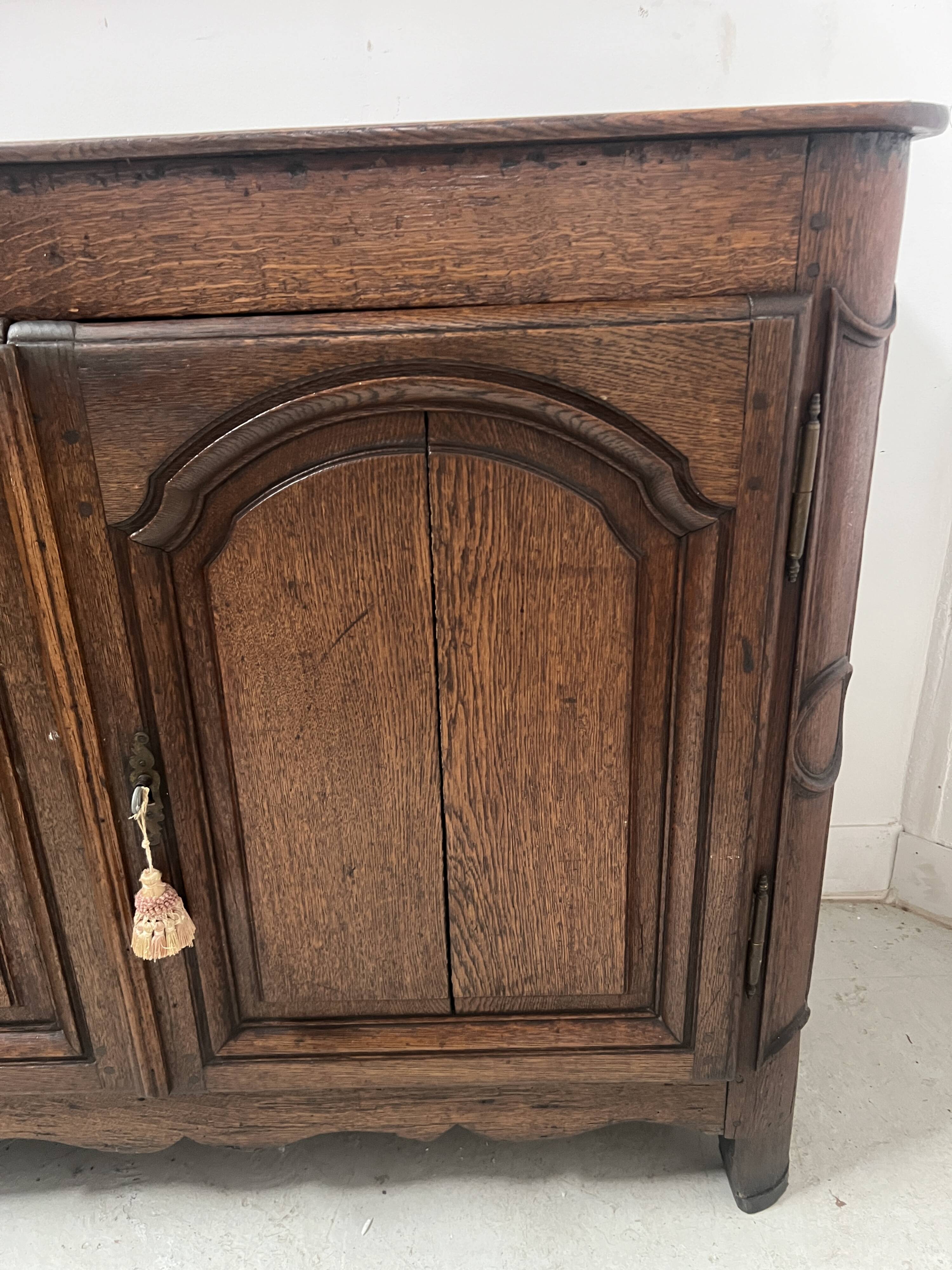 Two-door buffet in solid oak, Louis XIV style, 18th century.