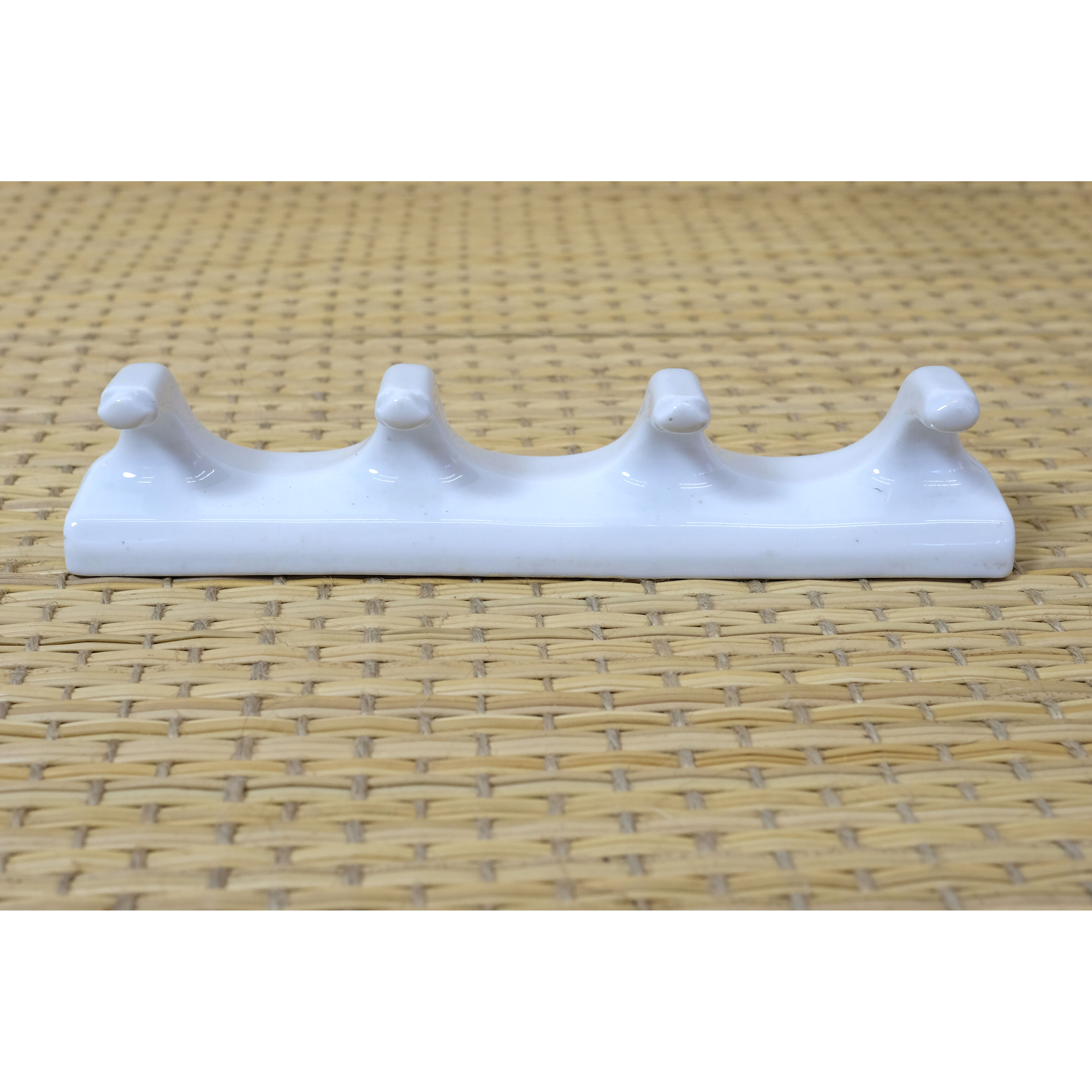 Tea towel holder or porcelain towel with 4 hooks.