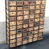 Black metal storage cabinet with 60 wooden drawers