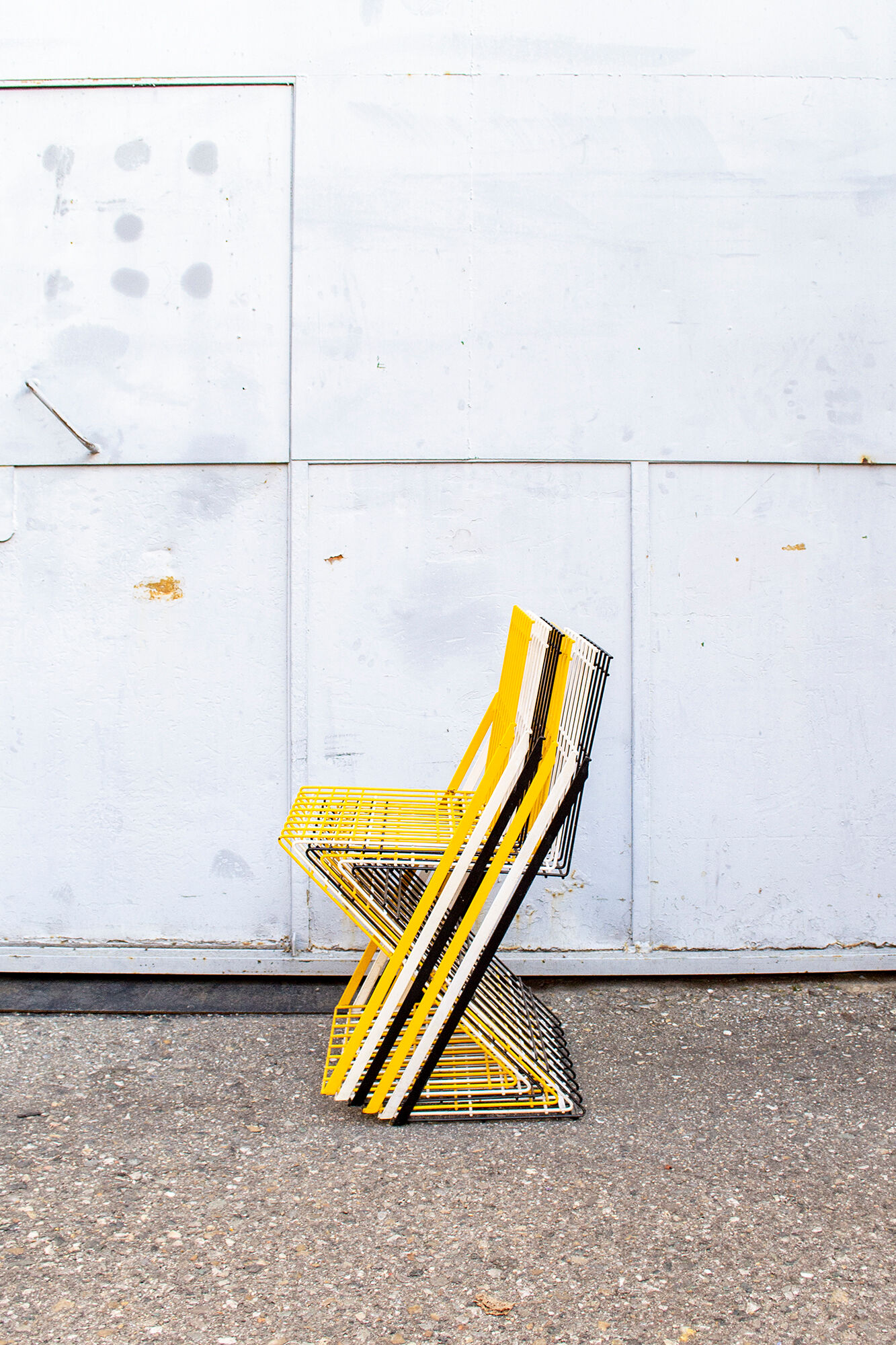 Stackable brutalist iron chairs Italy 70s