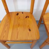 Suite of a round table with extension and 4 vintage pine chairs from the 60s and 70s