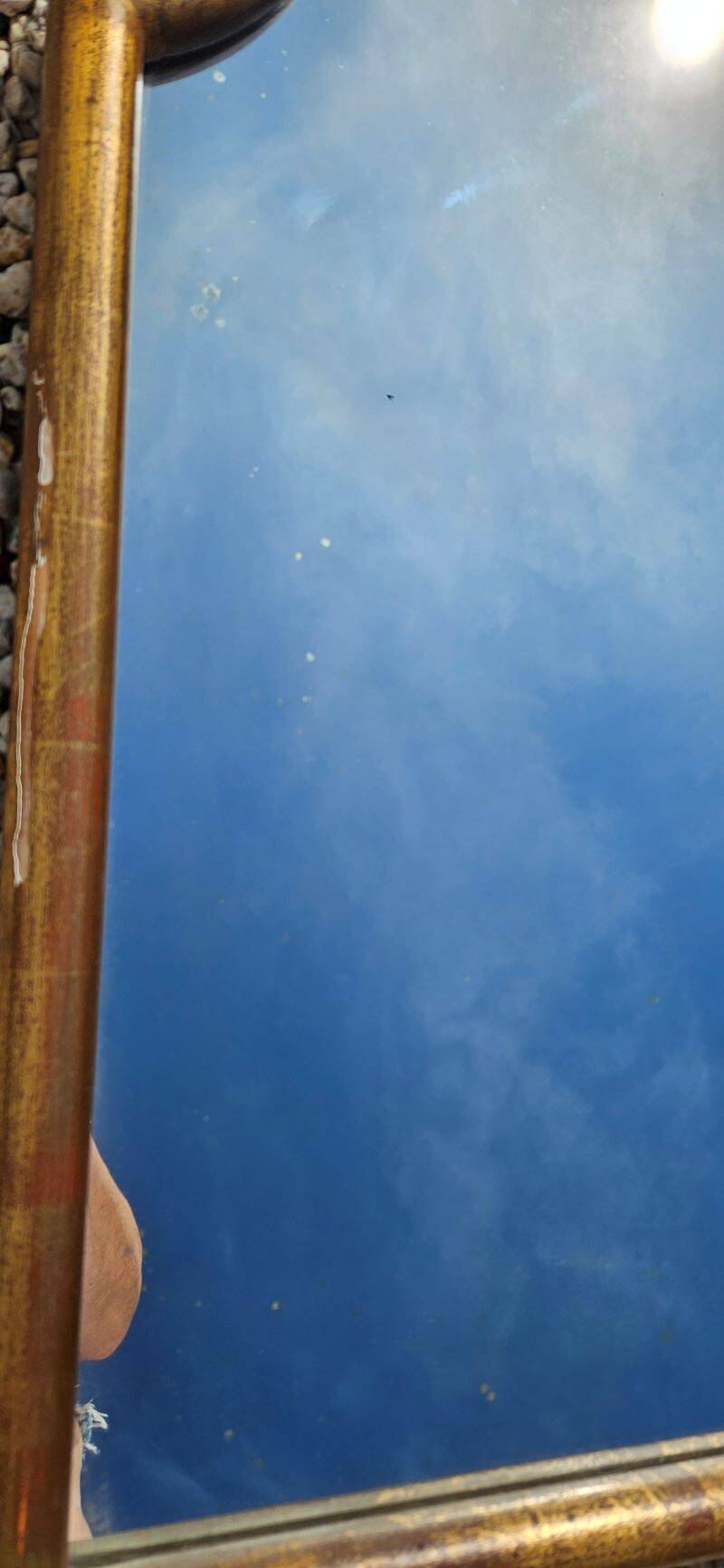Large gilded wooden mirror in the shape of a gendarme hat