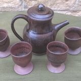 Teapot and ceramic cup signed JP