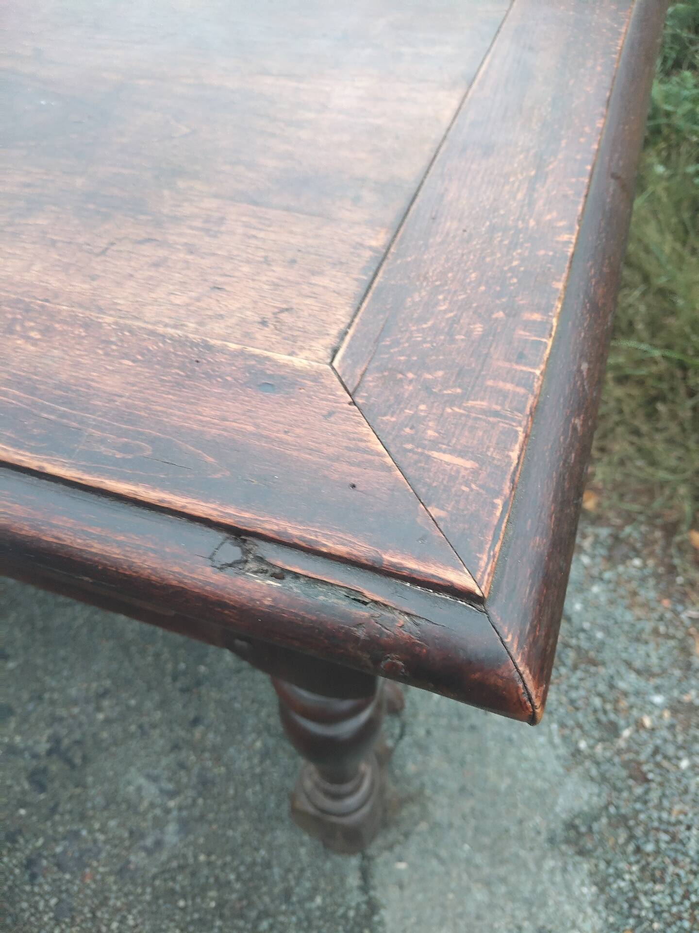 Small antique writing table in Louis XIII style made of oak.