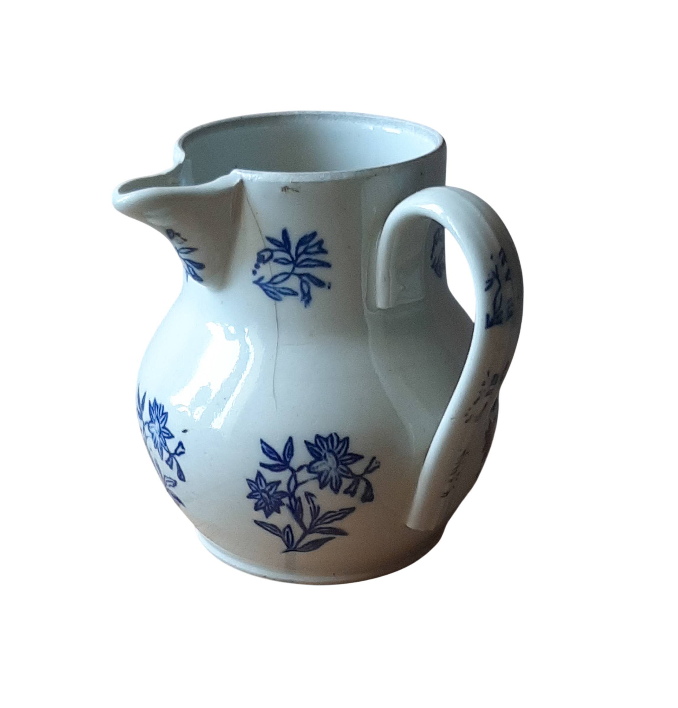 Large antique cruet in Saint Uze earthenware with blue flowers.