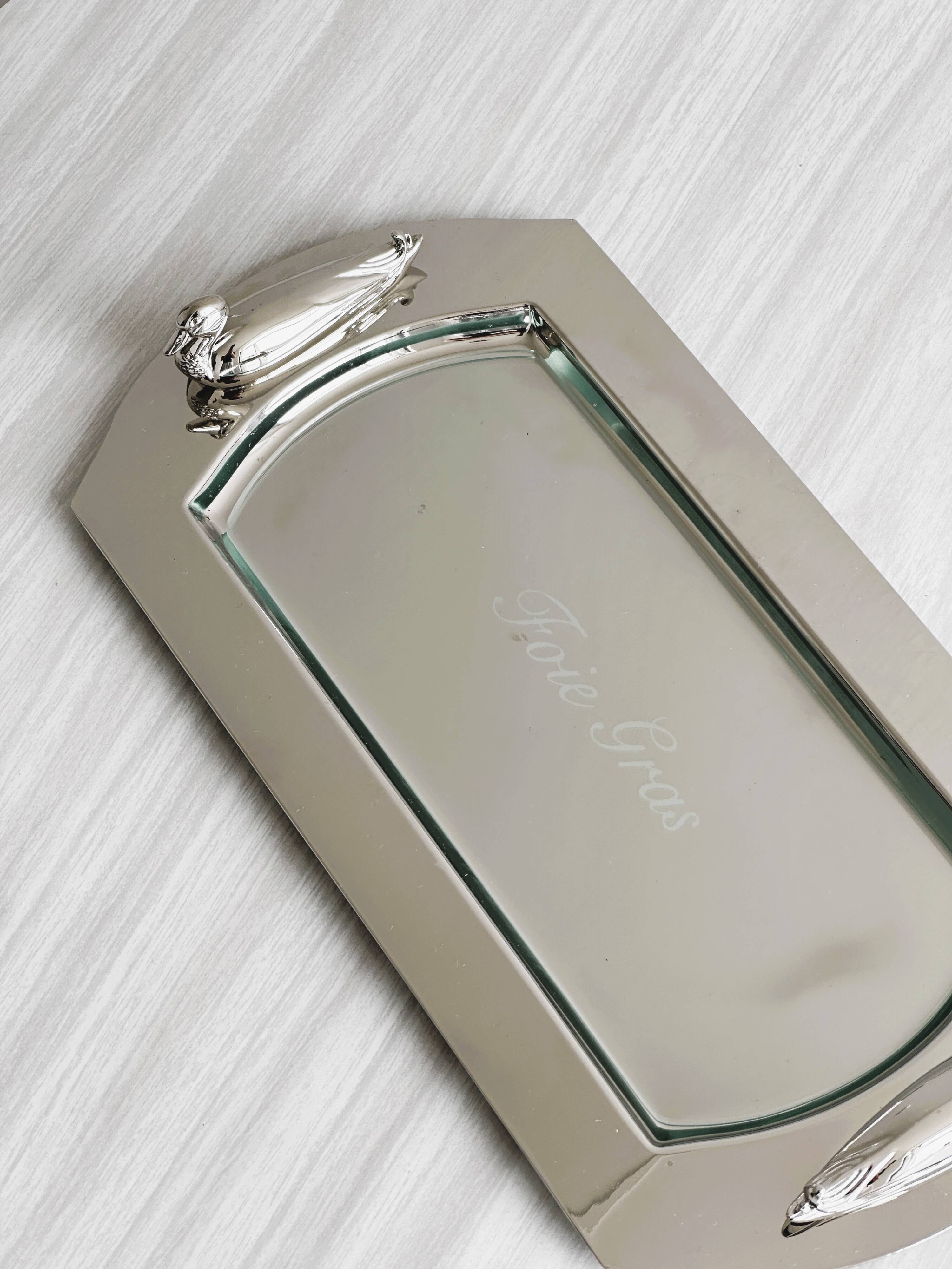 Shiny metal foie gras dish