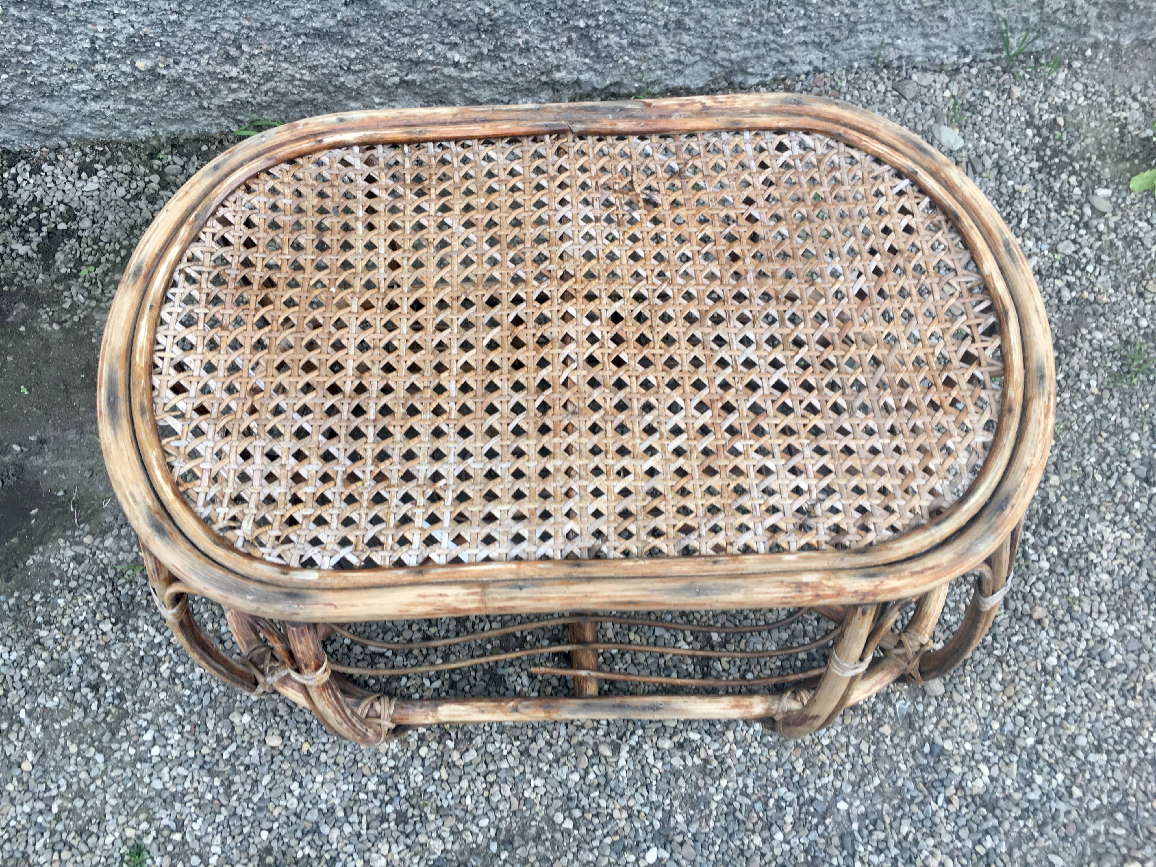 Pair of rattan armchairs and vintage oval table