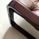Scandinavian armchair with turned wood and brown patchwork leather, 70s design.
