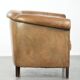 Vintage sheepskin club armchair finished with decorative nails