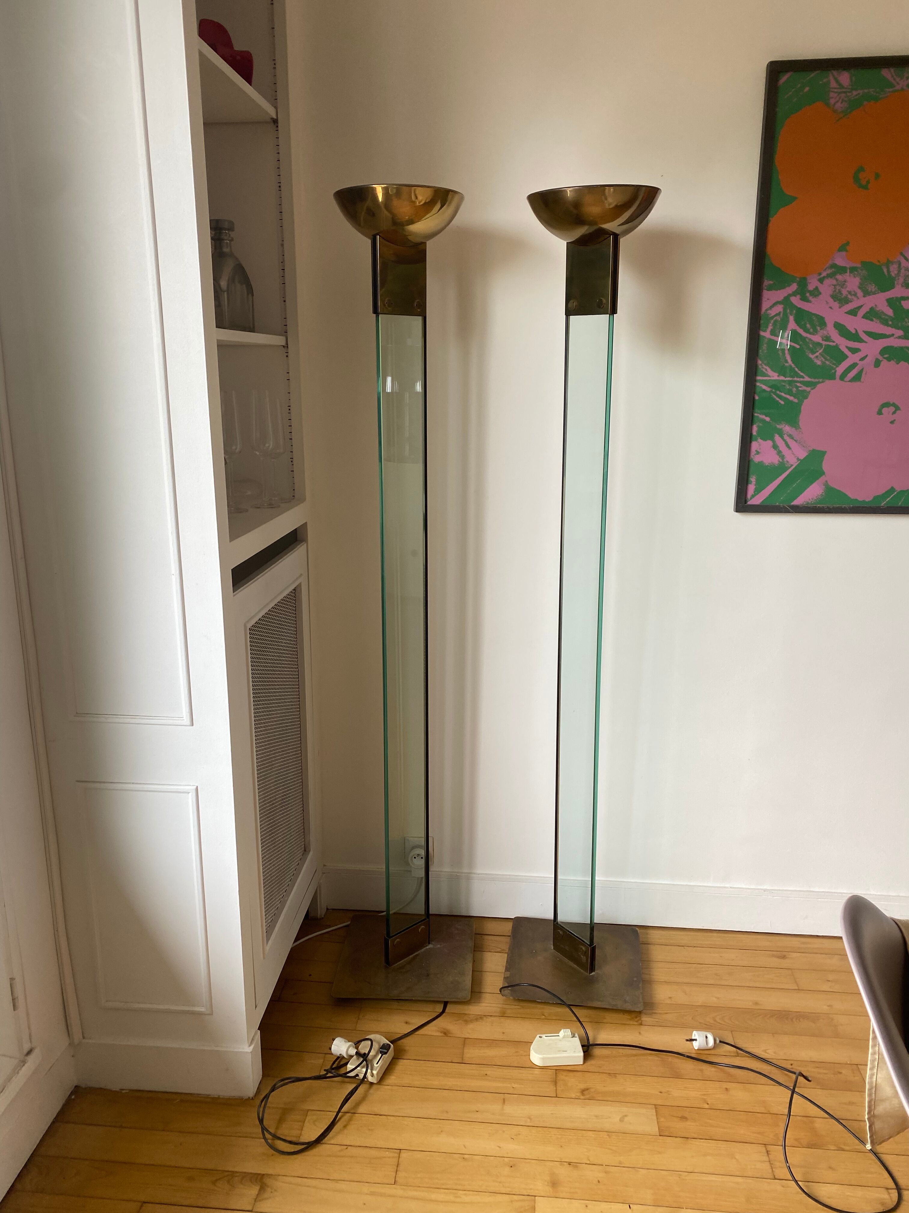 Pair of large glass and brass floor lamps in the 70s
