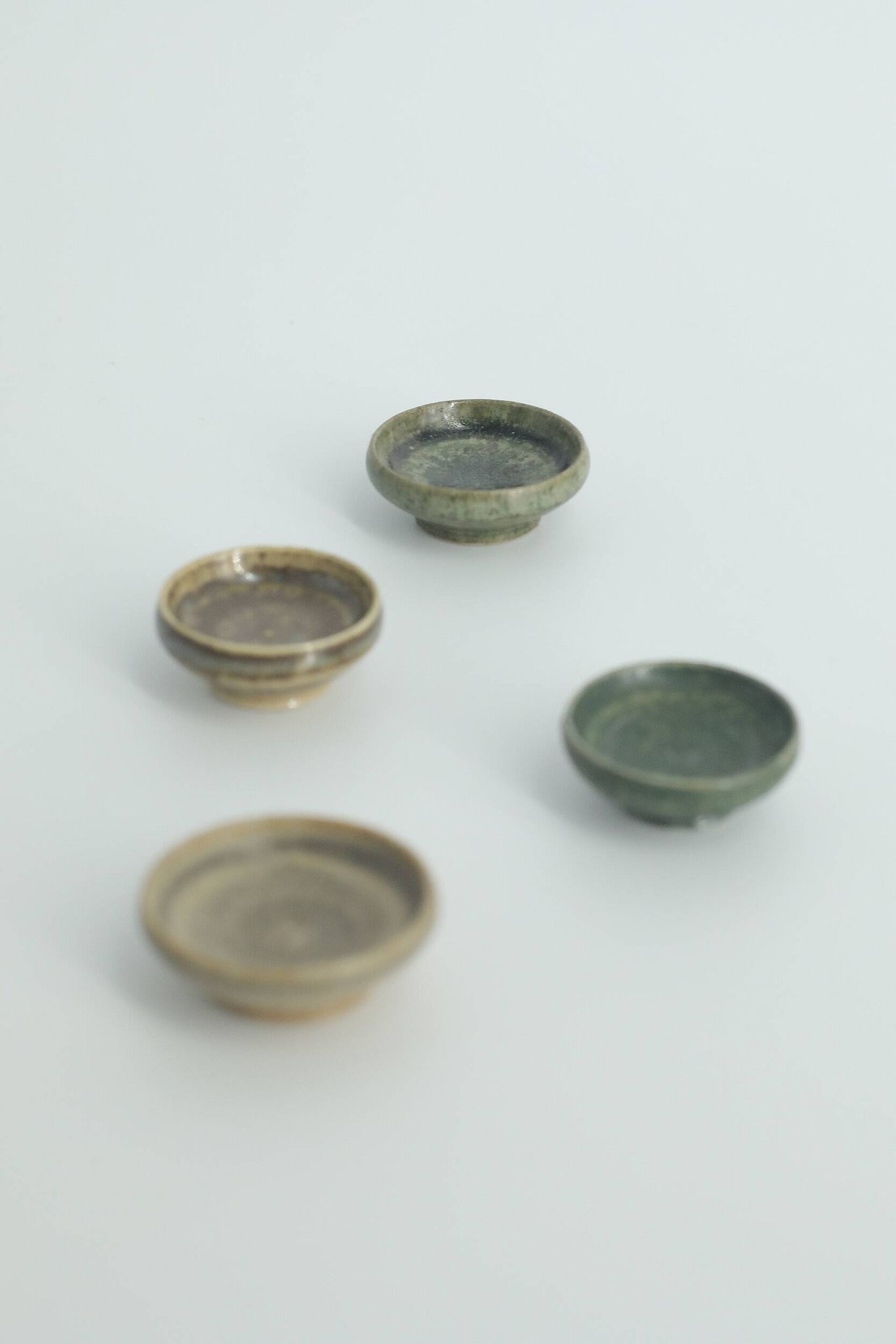 Set of 4 Scandinavian collection bowls in brown and green stoneware, mid-20th century.