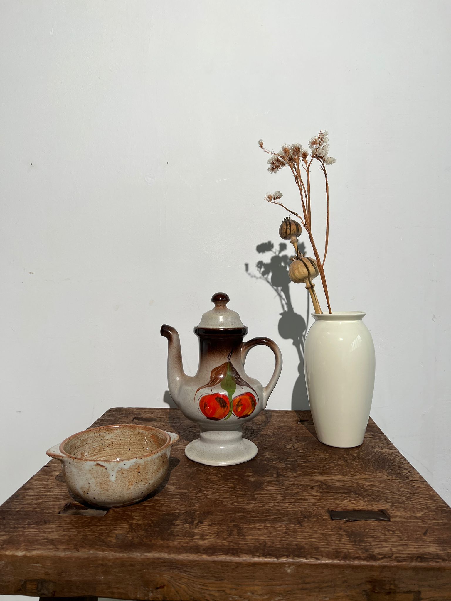 Vintage stoneware teapot with flower and fruit patterns
