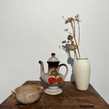 Vintage stoneware teapot with flower and fruit patterns