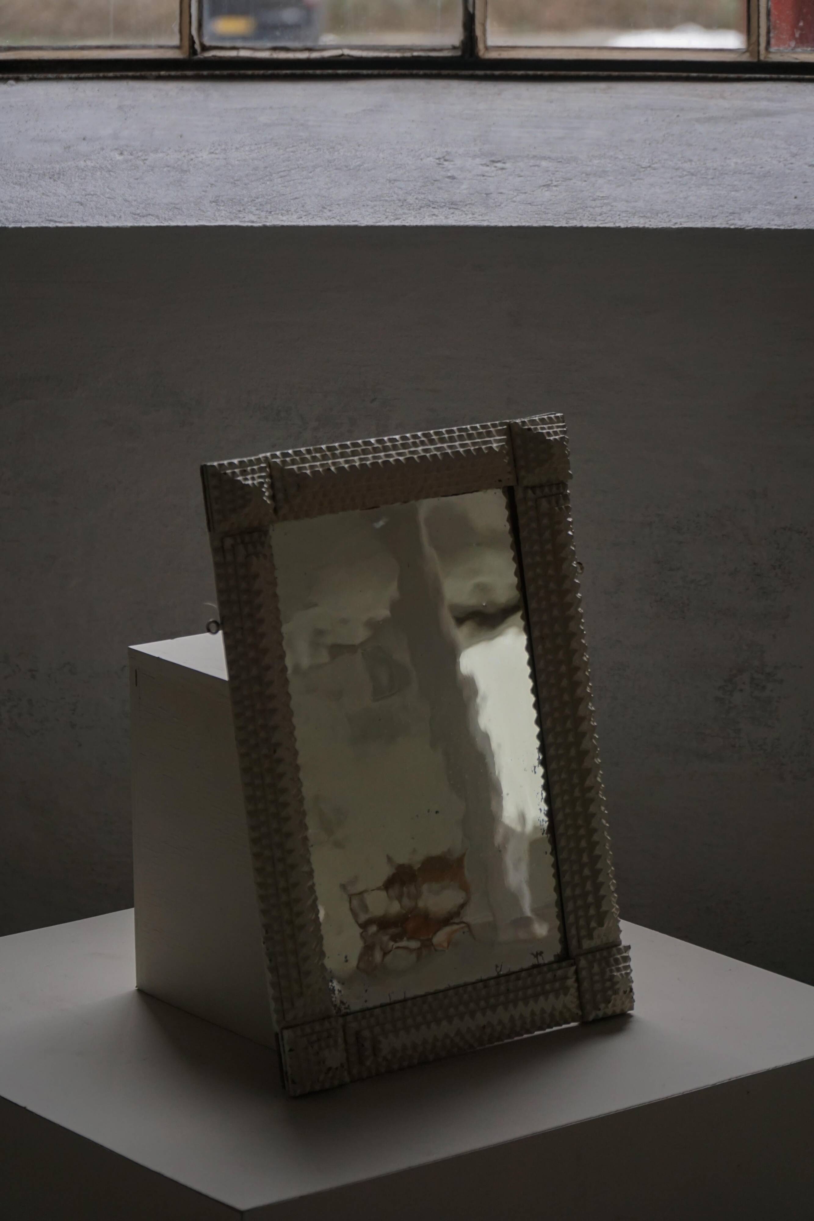 Wall mirror in tramp art style, hand-carved with a painted white frame, early 1900s.