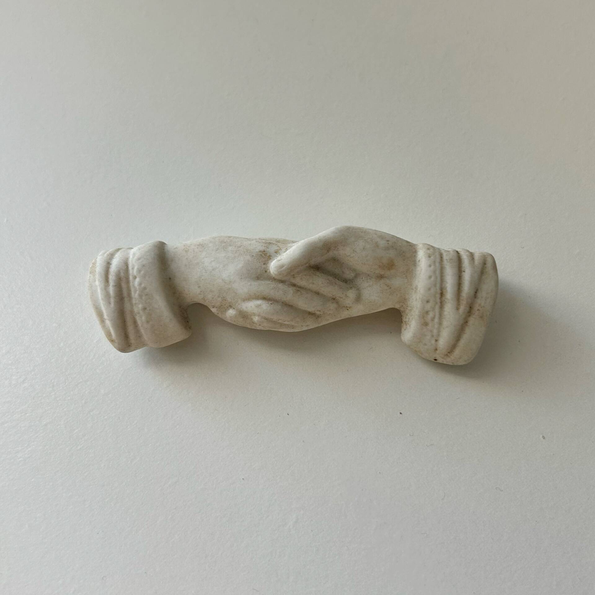 Knife holder with hands joined