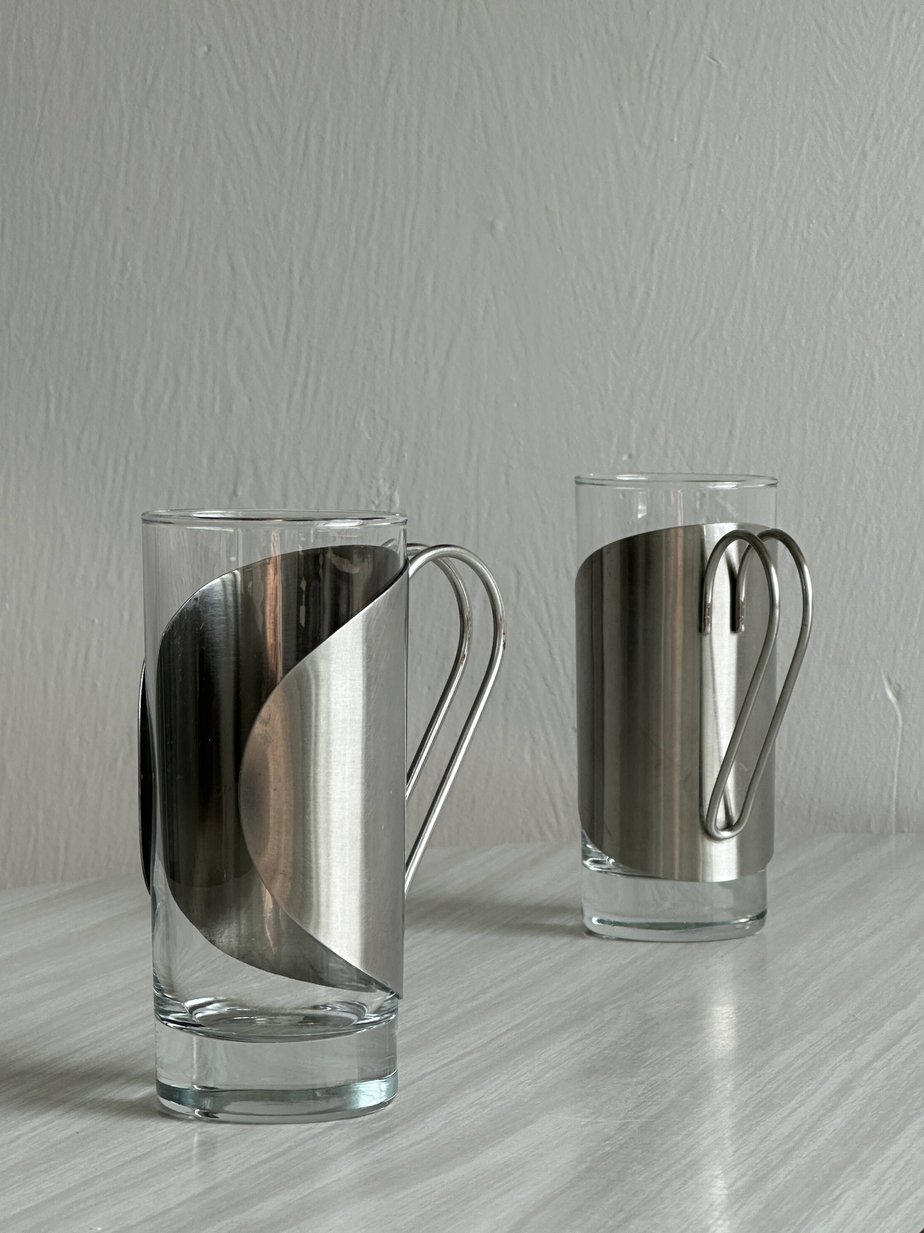 2 glasses with metal handles, stainless steel.