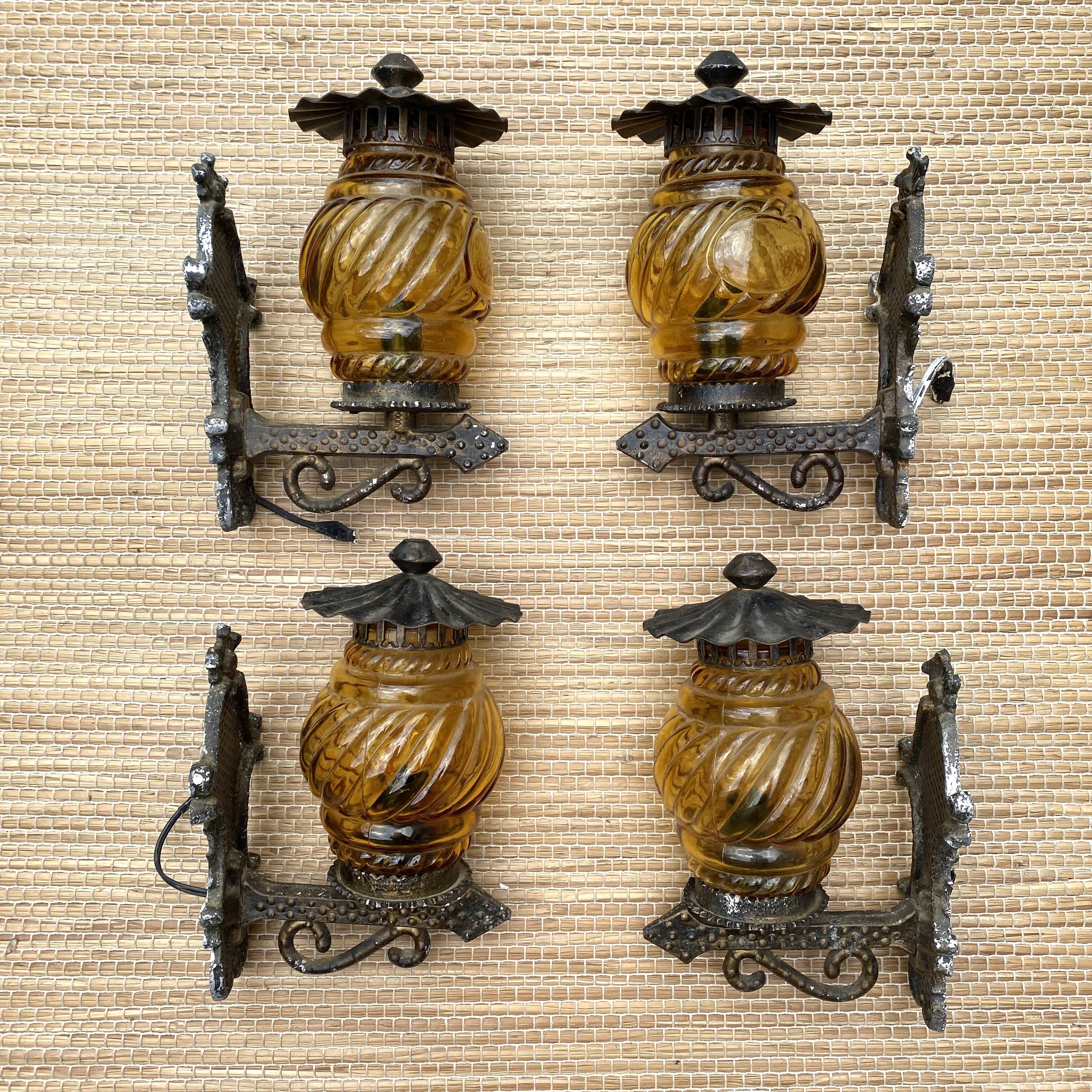 Medieval style metal and amber glass wall lamp