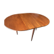 Teak round table with built-in extension