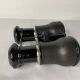 Old pair of binoculars sheathed leather black silver metal