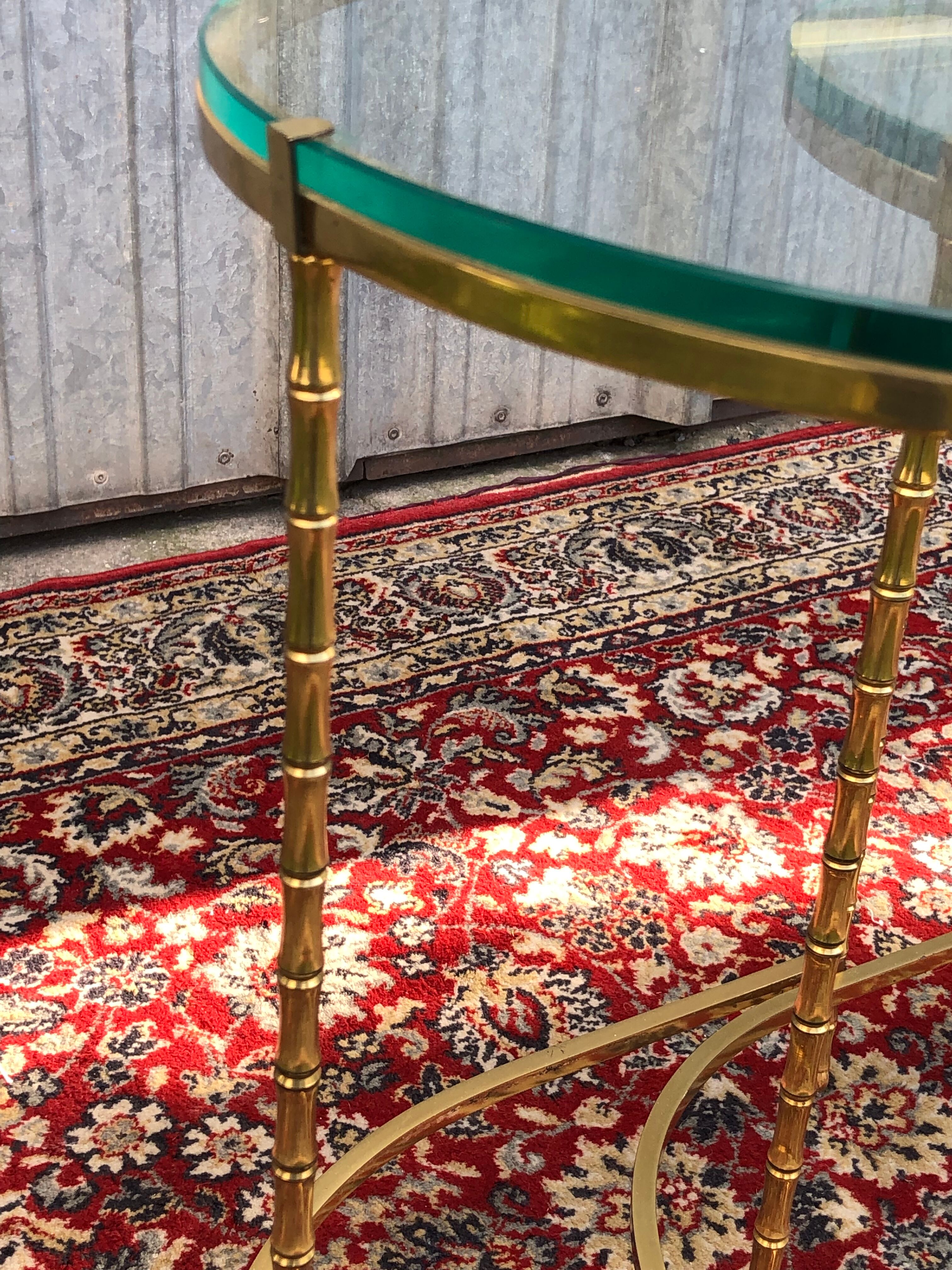 Suite of 3 trundle tables in golden brinze and glass slabs period 1970/1980