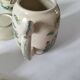 Japanese-style tea set in cracked earthenware with chrysanthemum flowers