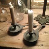 Pair of cast iron candle holders
