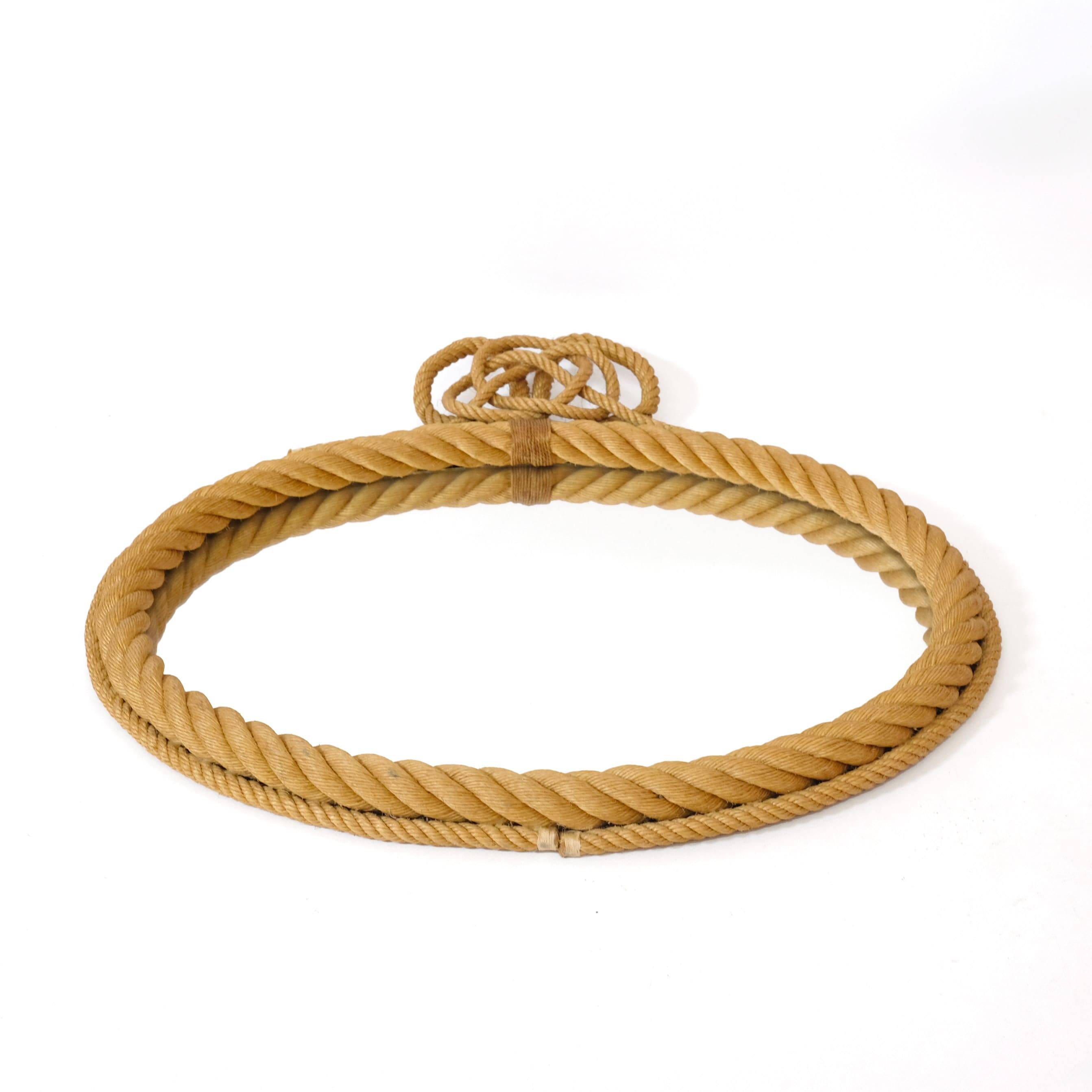 Large oval mirror in rope with pediment, 64cm x 56.5cm.