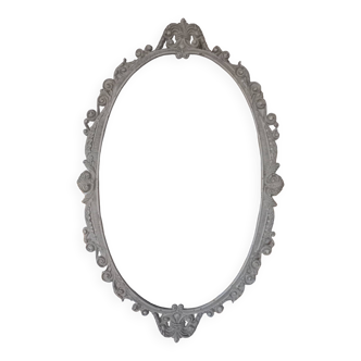 Large oval metal frame medallion