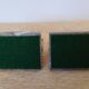 Small roaring lion bookends in patinated metal on a marble base.