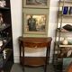 Cherry half-moon console with drawer and bottom shelf