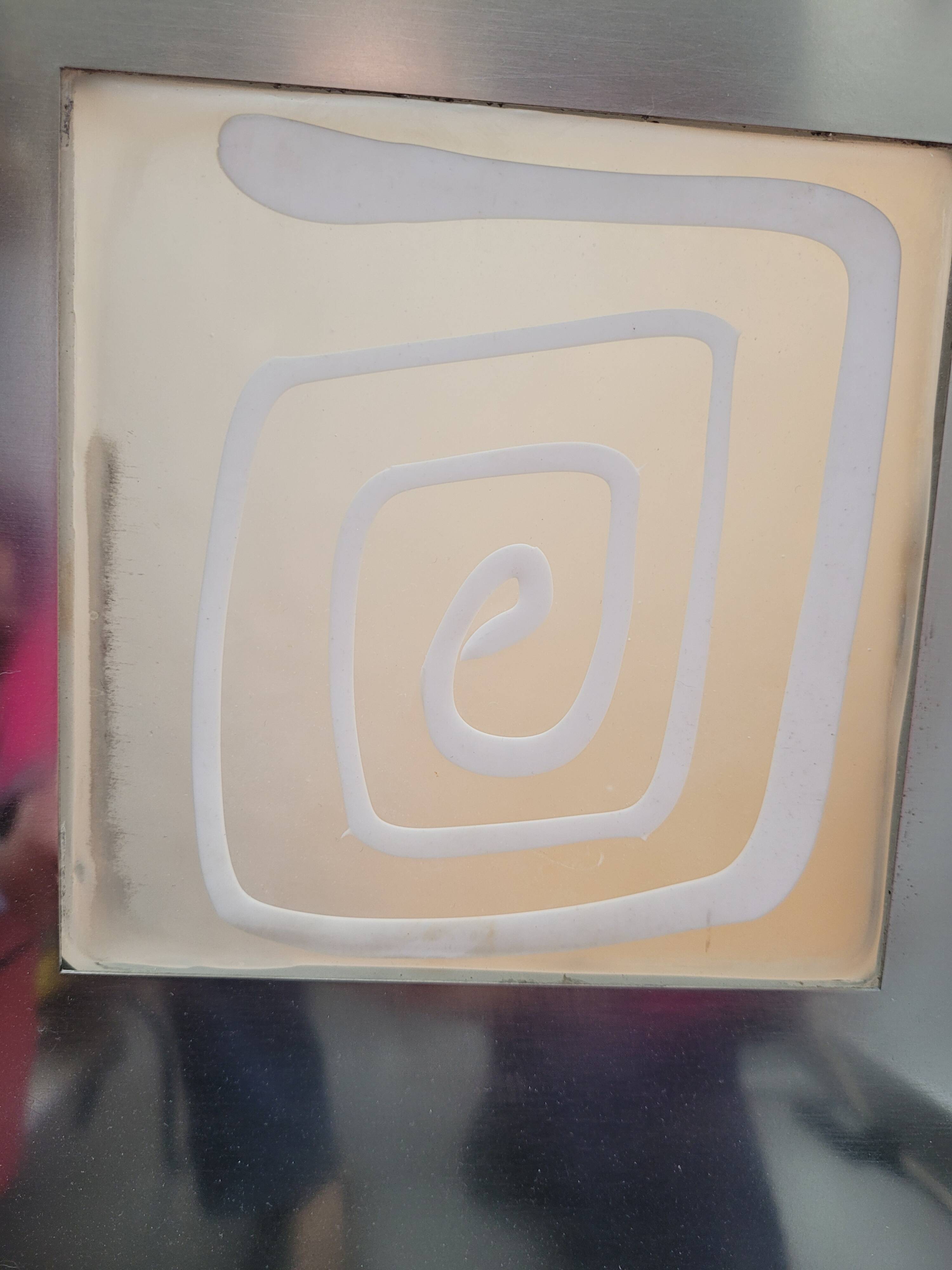 Wall light by Angelo Brotto, polished steel and Murano glass.