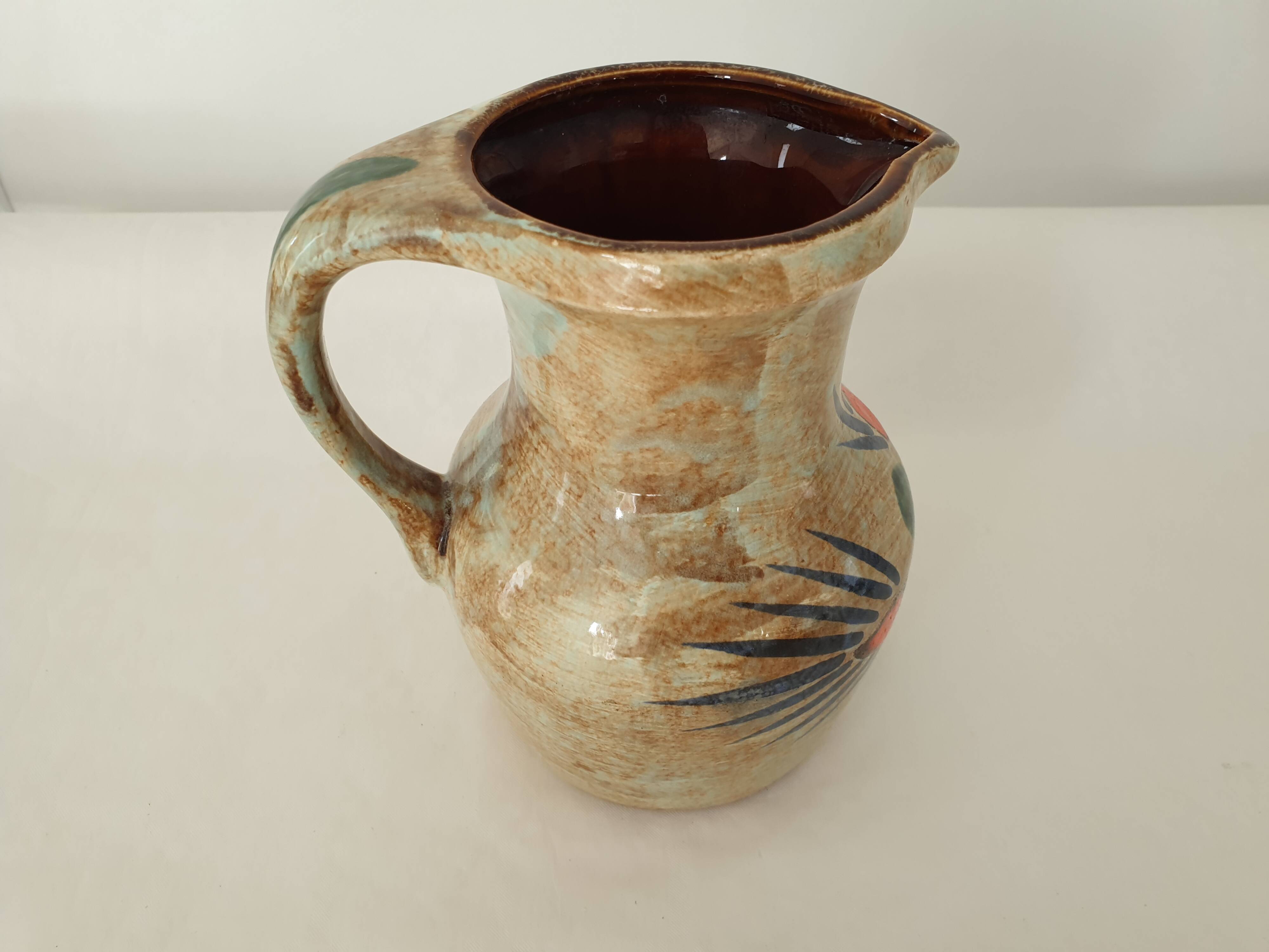 Ceramic pitcher with floral motif signed Saint Clément