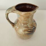 Ceramic pitcher with floral motif signed Saint Clément