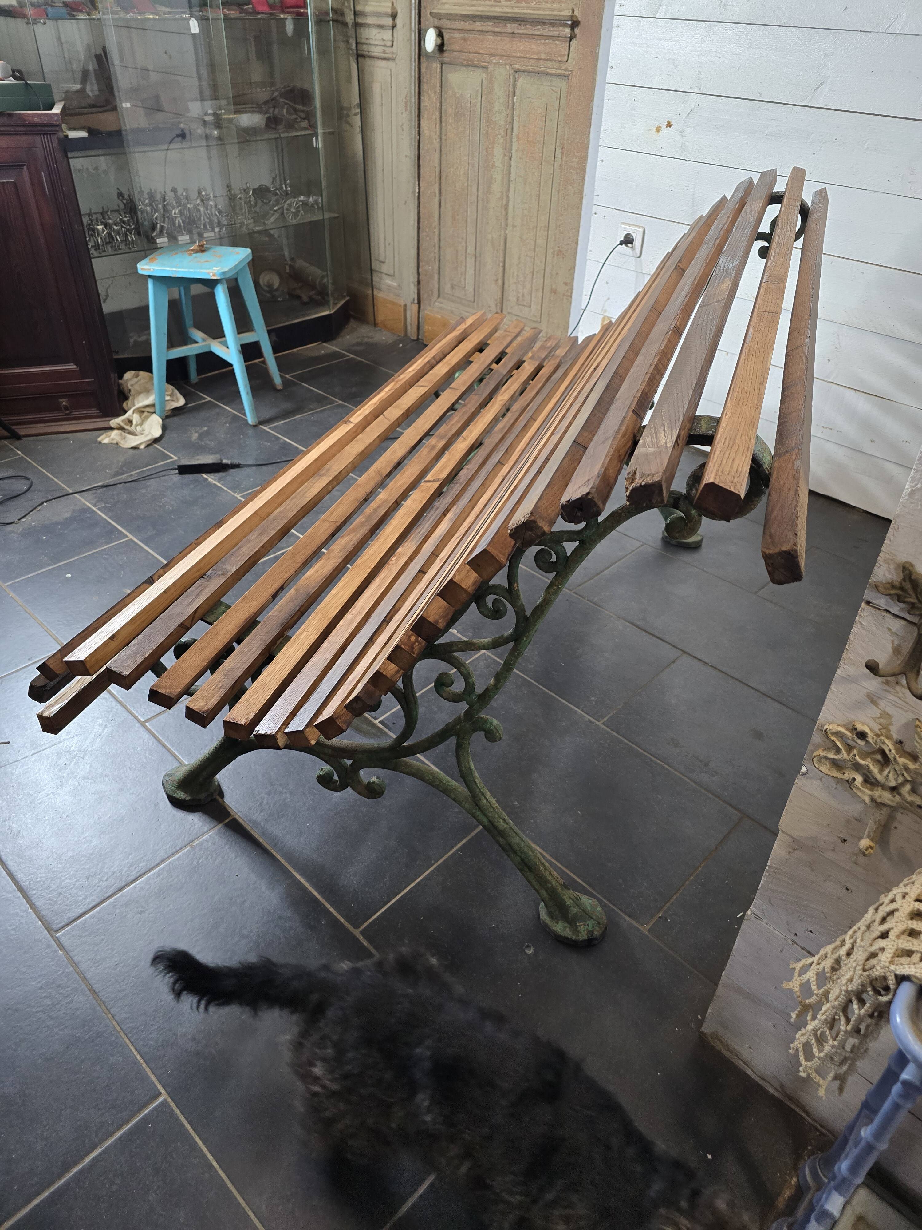 Old cast iron garden bench with oak slats