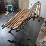 Old cast iron garden bench with oak slats