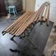 Old cast iron garden bench with oak slats