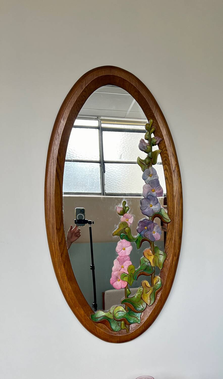 Carved wooden mirror with flower decorations