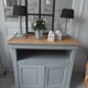 Louis Philippe-style storage furniture with grey wood tray, it is composed of a niche with sliding tray and below a storage closed by 2 doors.