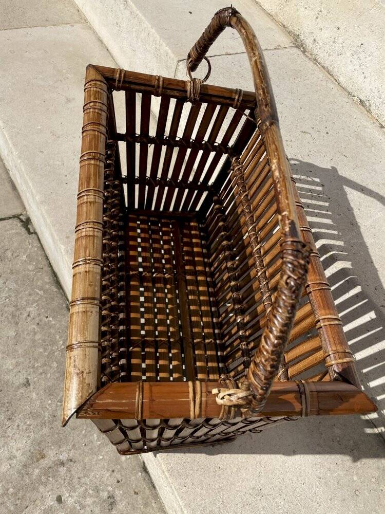Brown wicker/rattan basket-shaped magazine rack