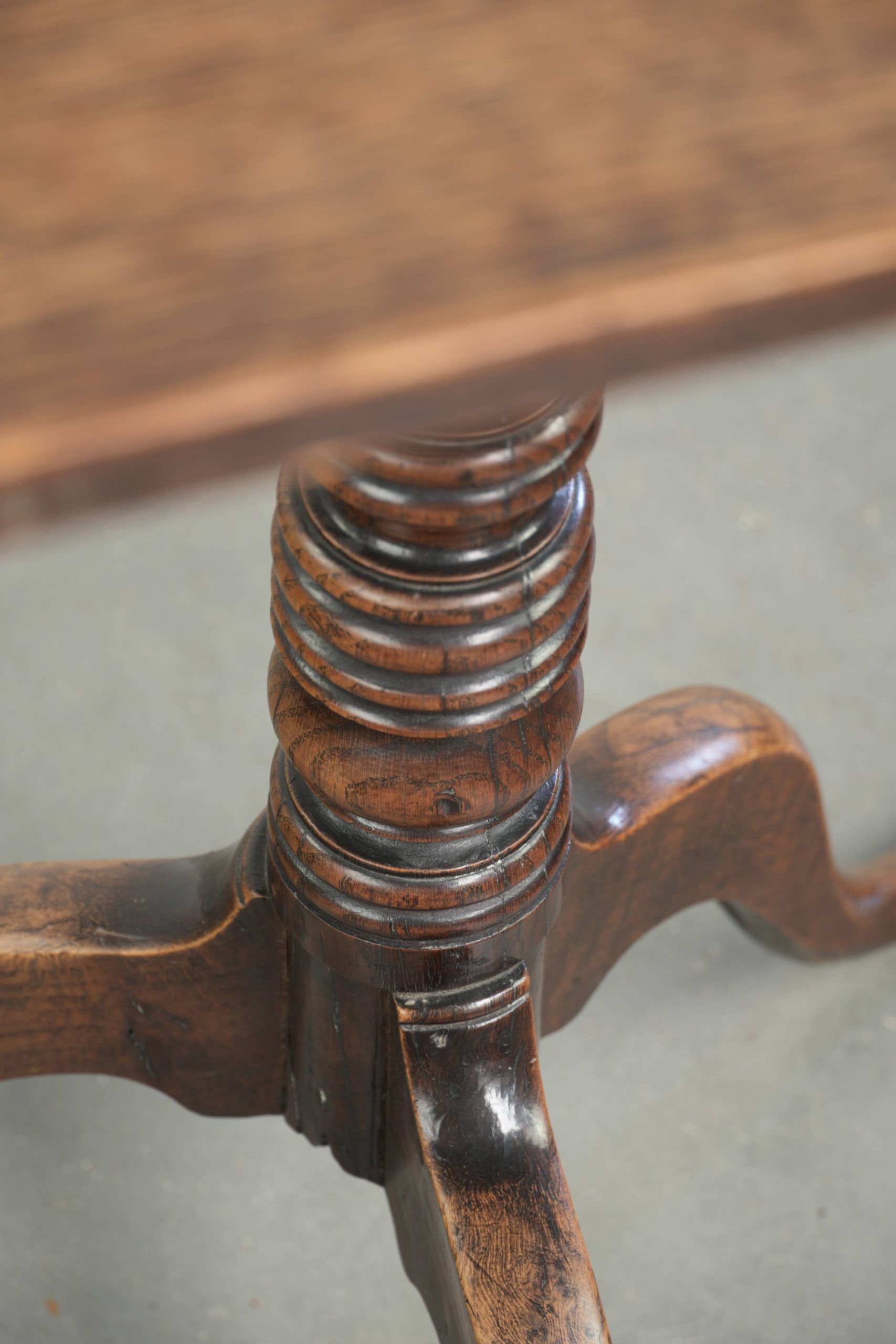 Antique English oak tilt top table from the 19th century in a unique shape