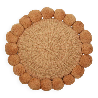 Mini round cushion with ochre wool pompoms