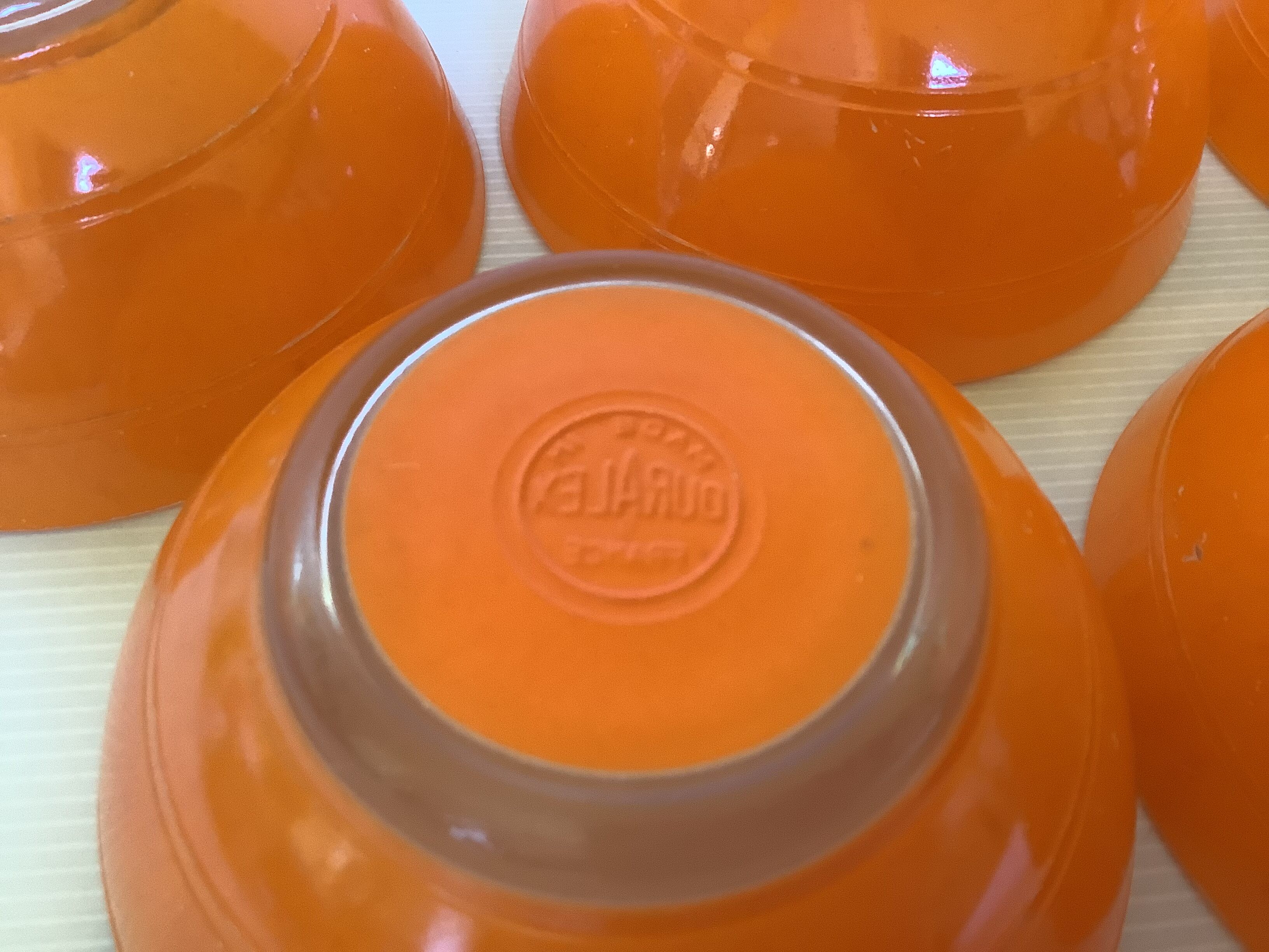 Five old orange duralex bowls