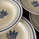 Set of 6 vintage deep plates in earthenware with blue lily of the valley flowers.