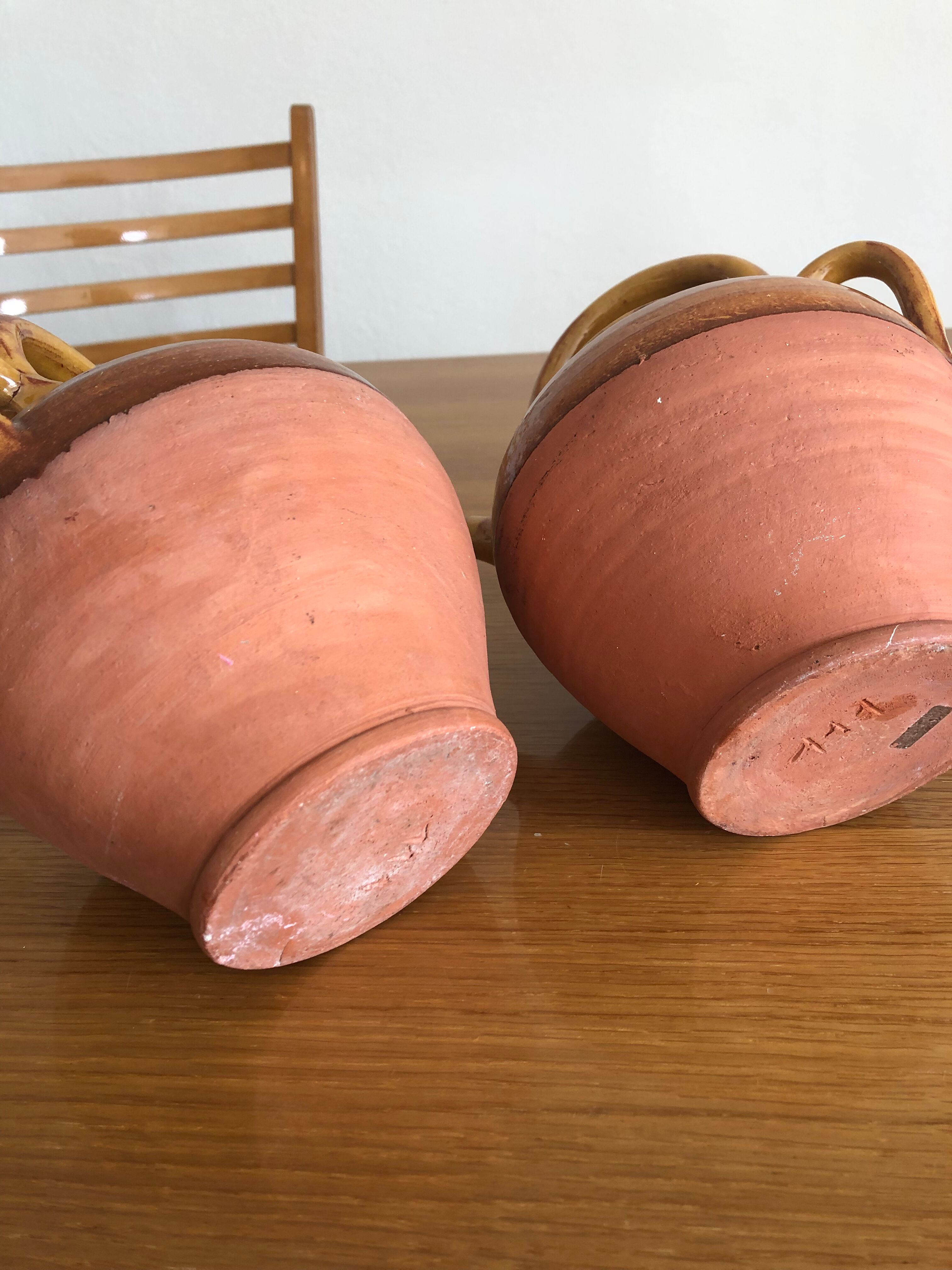 Pair of vintage terracotta watering cans