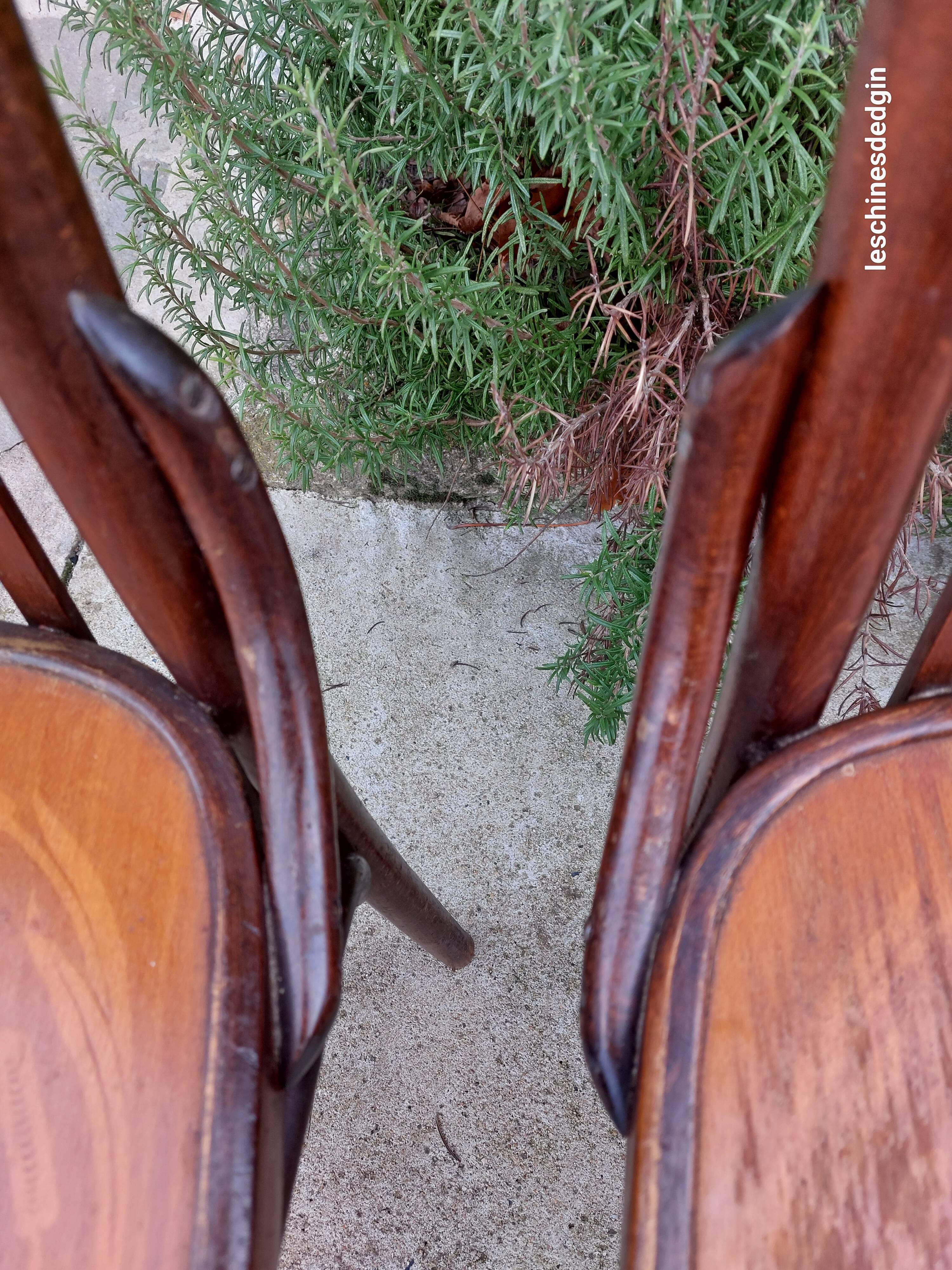 4 bentwood bistro chairs with a pattern on the seat