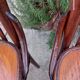 4 bentwood bistro chairs with a pattern on the seat