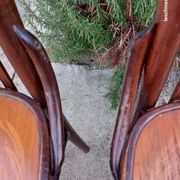 4 bentwood bistro chairs with a pattern on the seat