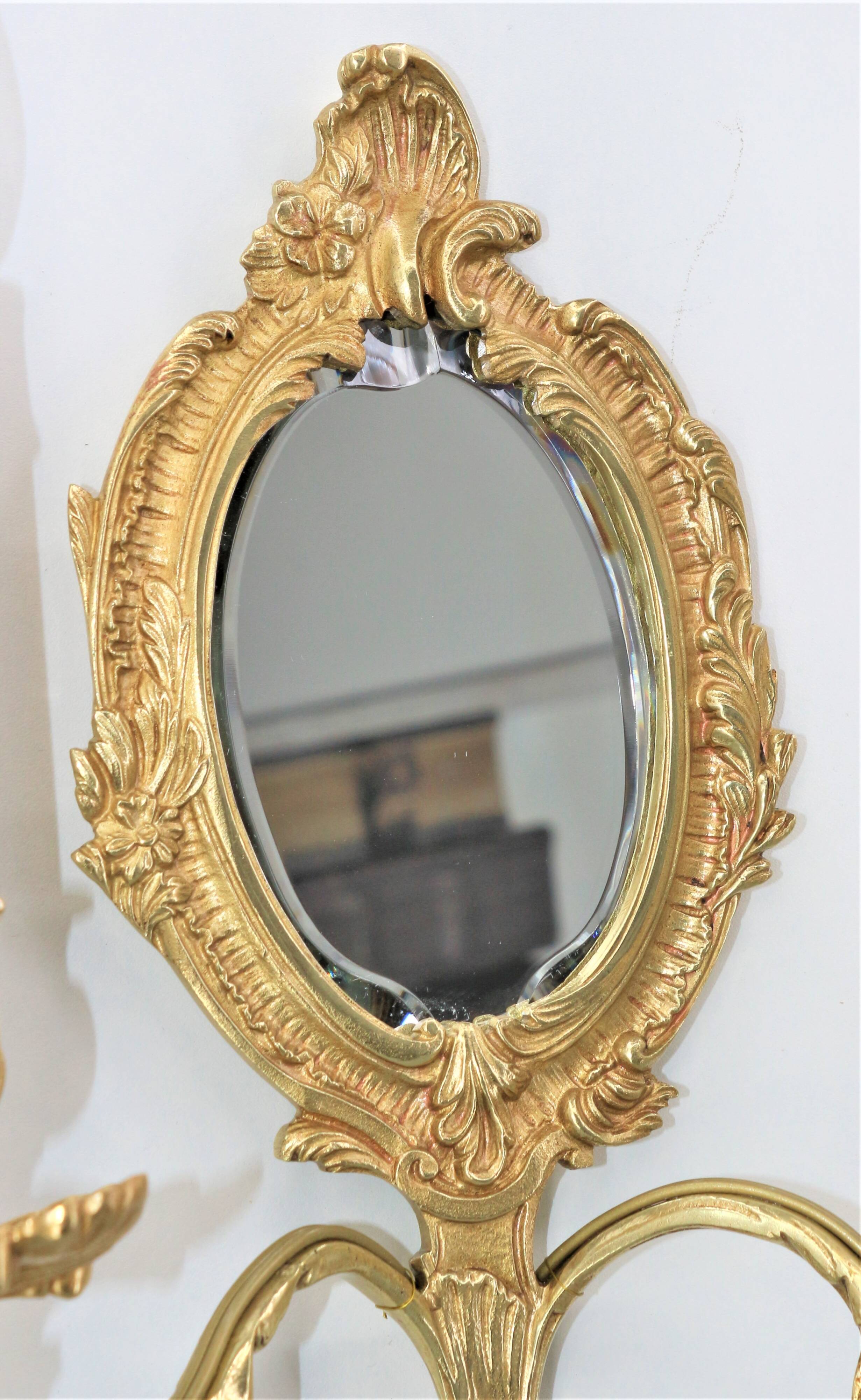 Pair of Louis XV style beveled mirror sconces in bronze by Lucien Gau