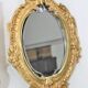 Pair of Louis XV style beveled mirror sconces in bronze by Lucien Gau