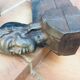 Pair of cast-iron chenet characters with laurels
